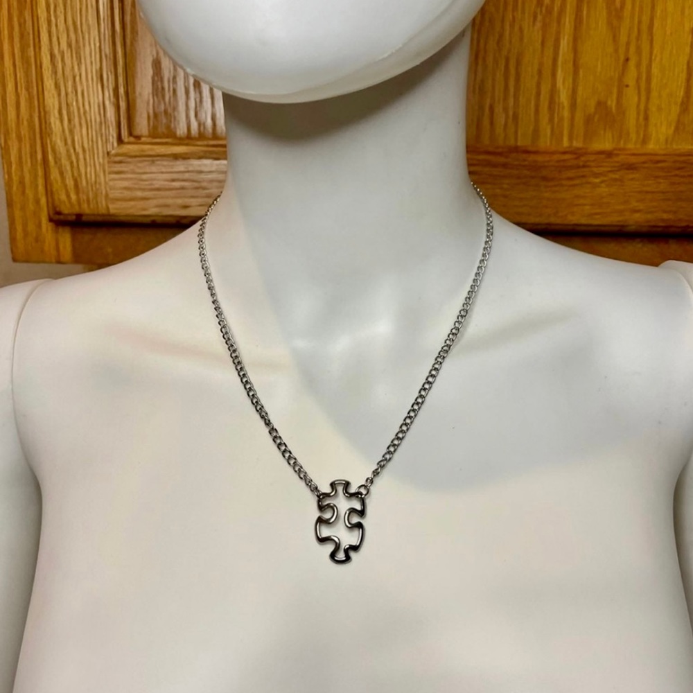 Elegant Silver Puzzle Piece Necklace